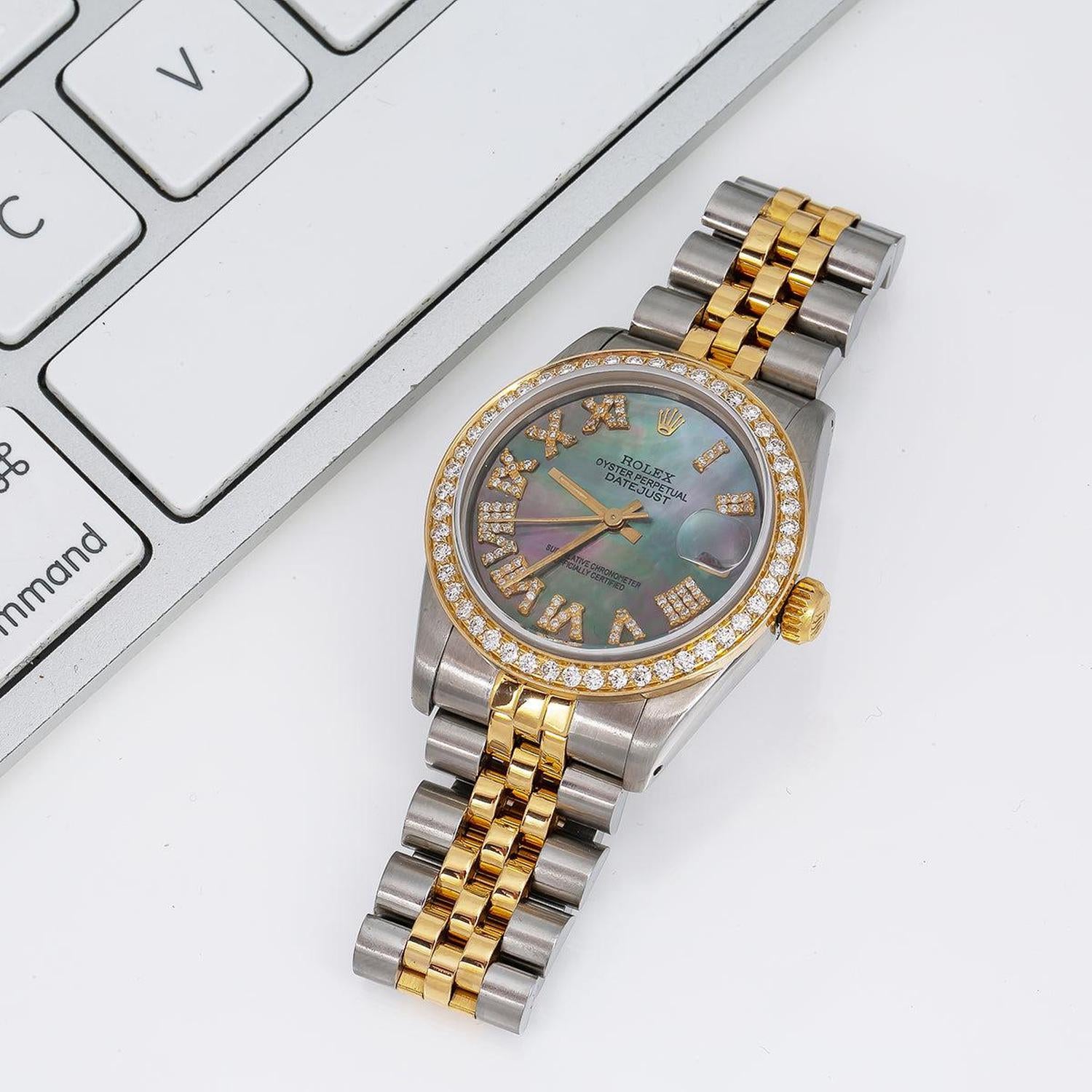 Rolex Datejust 31MM 6824 Black Mother of Pearl Roman Diamond Dial Diamond Bezel Two Tone Yellow Gold Jubilee Bracelet