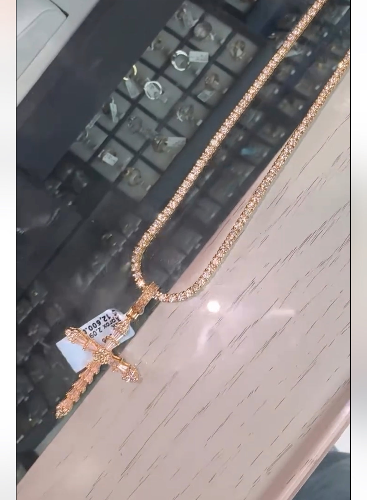 White gold tennis chain and cross