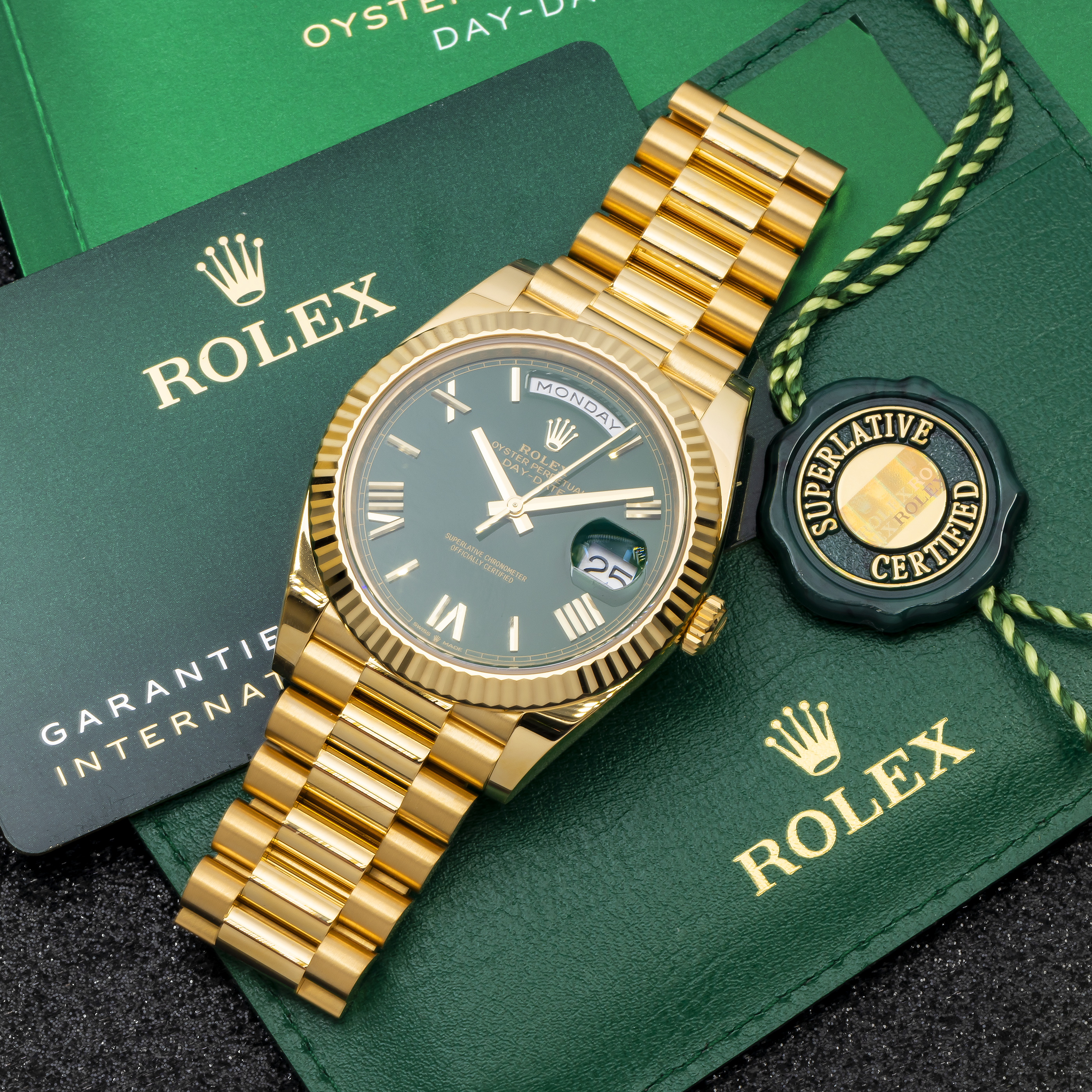 Rolex Day-Date 40MM 228238 Green Roman Dial Fluted Bezel 18K Yellow Gold President Bracelet