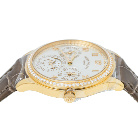 PATEK PHILIPPE GRAND COMPLICATIONS LADIES FIRST PERPETUAL CALENDAR YELLOW GOLD SILVER DIAL DIAMOND BEZEL 7140R-001/132