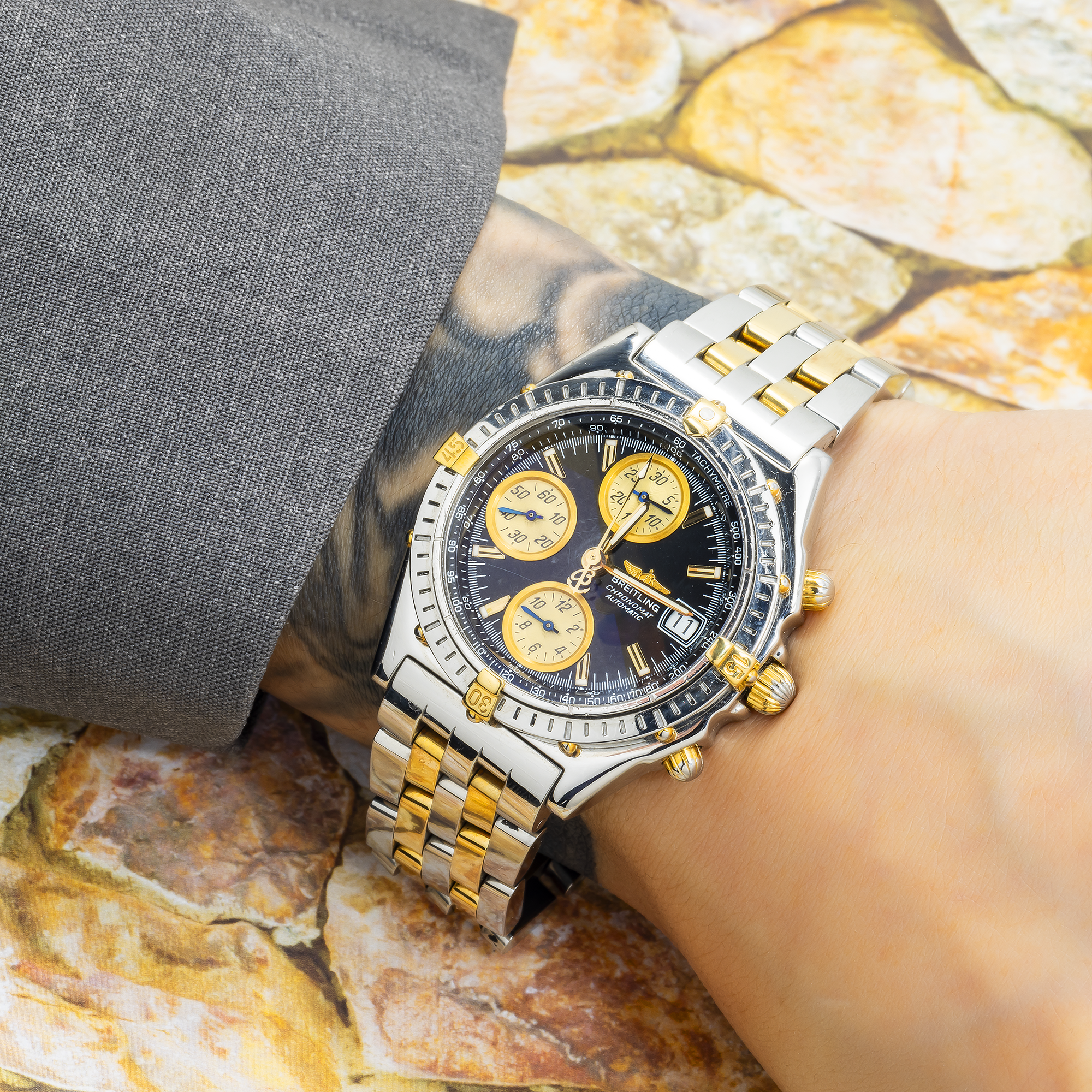 Breitling Chronomat 40MM B13050 Black Dial Two Tone Yellow Gold Bracelet