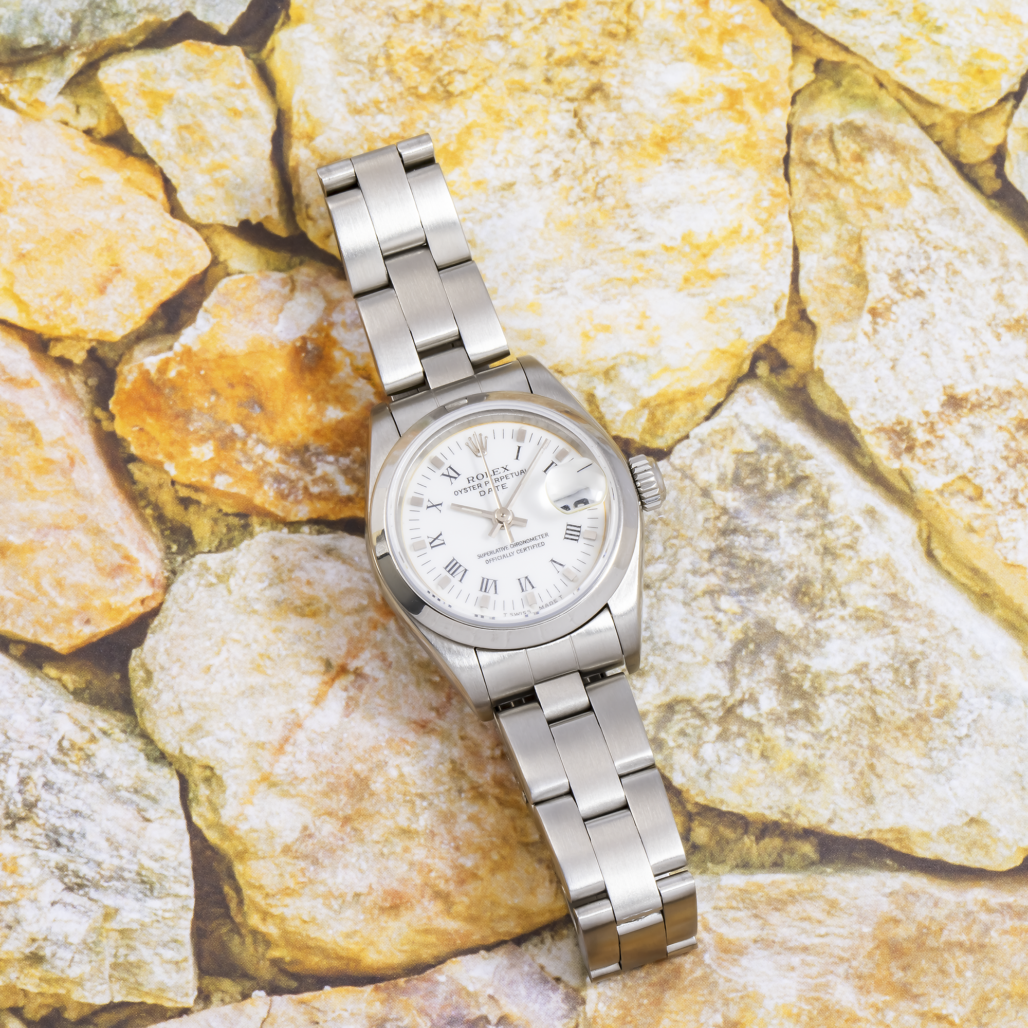 Rolex Date 26MM 69160 White Roman Dial Smooth Bezel Stainless Steel Oyster Bracelet