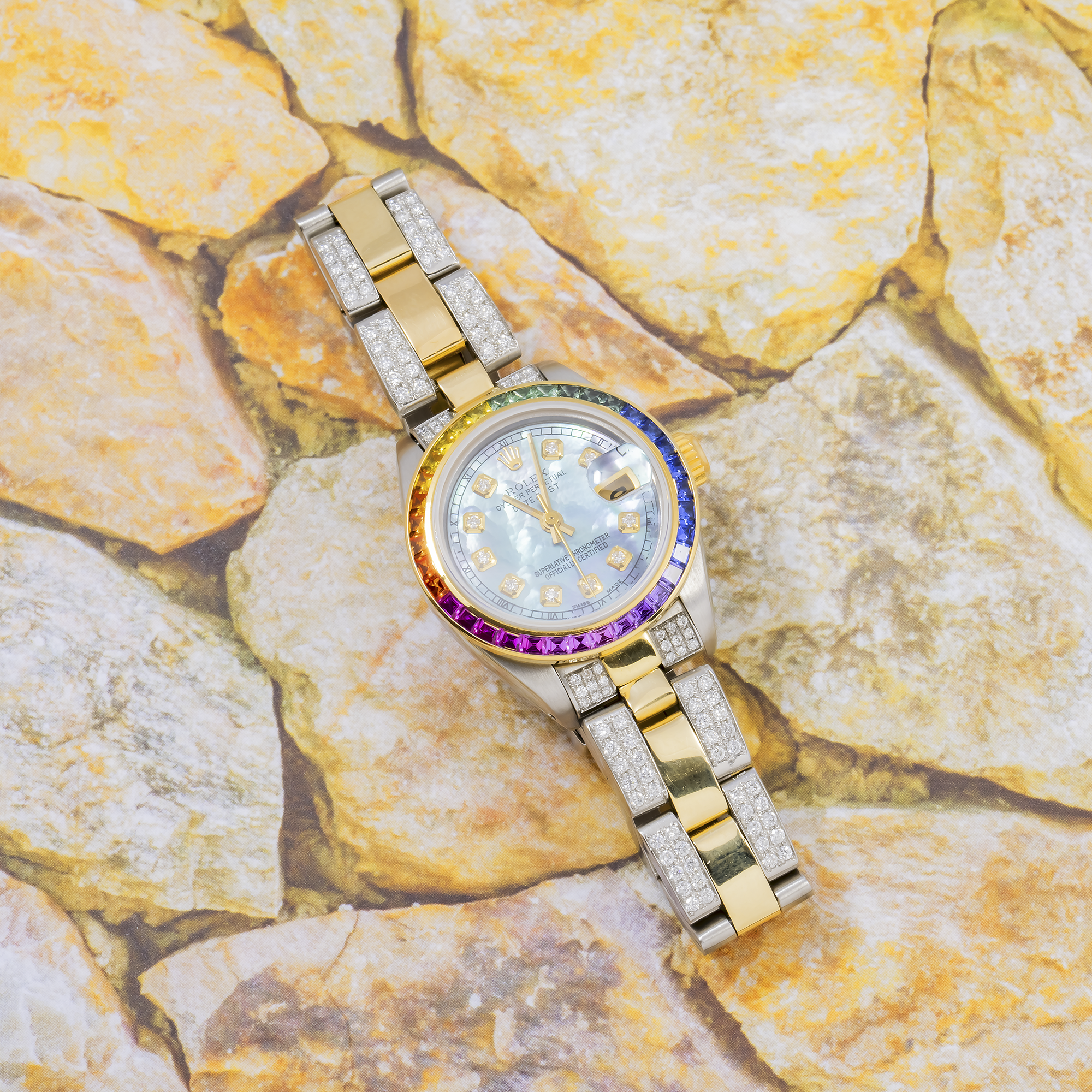 Rolex Datejust 26MM 69173 Blue Mother of Pearl Diamond Dial Rainbow Gemstone Bezel Two Tone Yellow Gold Semi Diamond Oyster Bracelet