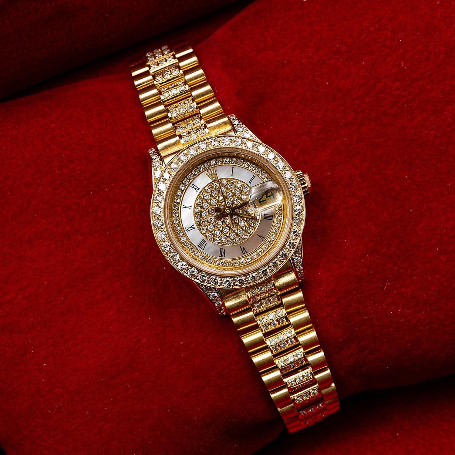 Rolex Datejust 26MM 69178 Diamond Paved Mother of Pearl Roman Dial Diamond Bezel 18K Yellow Gold President Bracelet