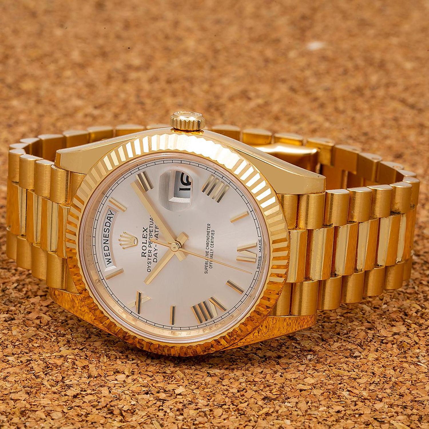 Rolex Day-Date 40MM 228238 Silver Roman Dial Fluted Bezel 18K Yellow Gold President Bracelet