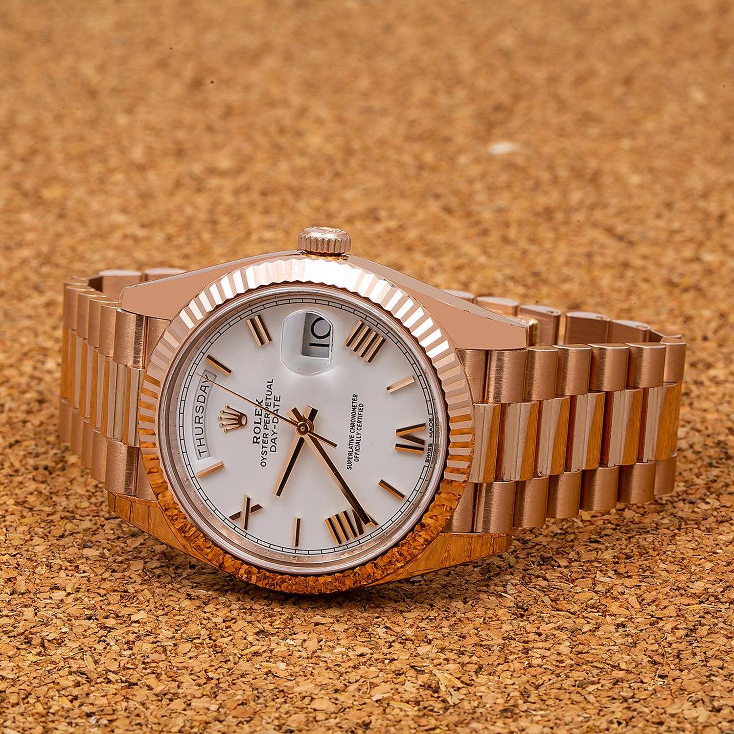 Rolex Day-Date 40MM 228235 White Roman Dial Fluted Bezel 18K Rose Gold President Bracelet