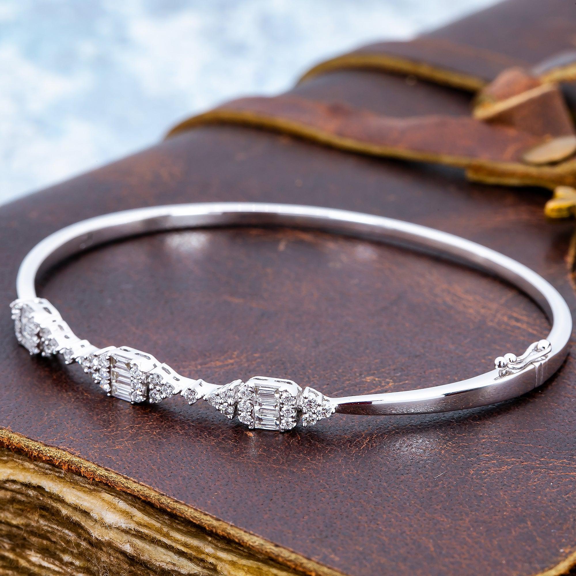 LADIES 18K WHITE GOLD GEOMETRIC BANGLE WITH ROUND AND BAGUETTE DIAMONDS