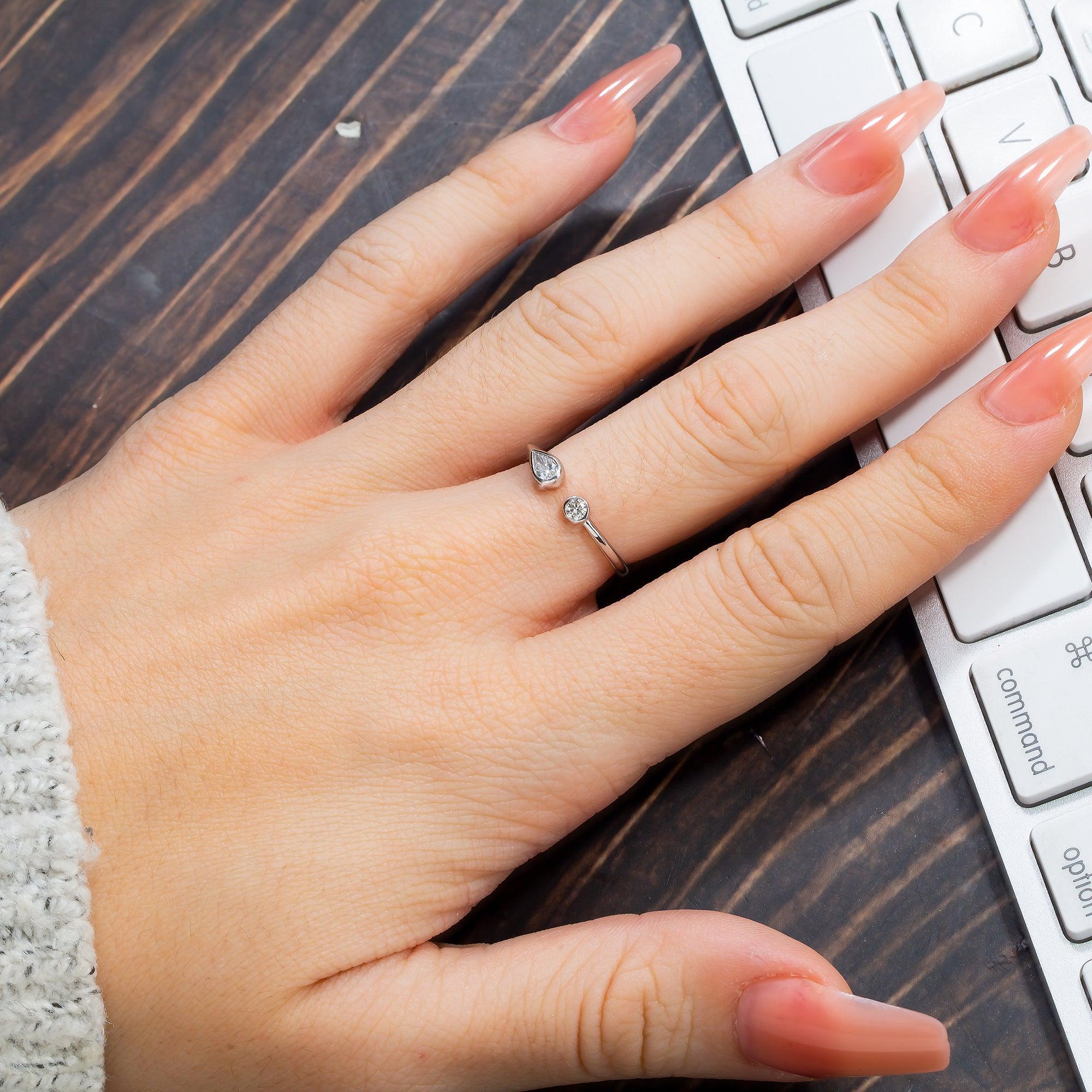 14K GOLD PEAR AND ROUND TWO DIAMOND BEZEL RING 0.25 CT