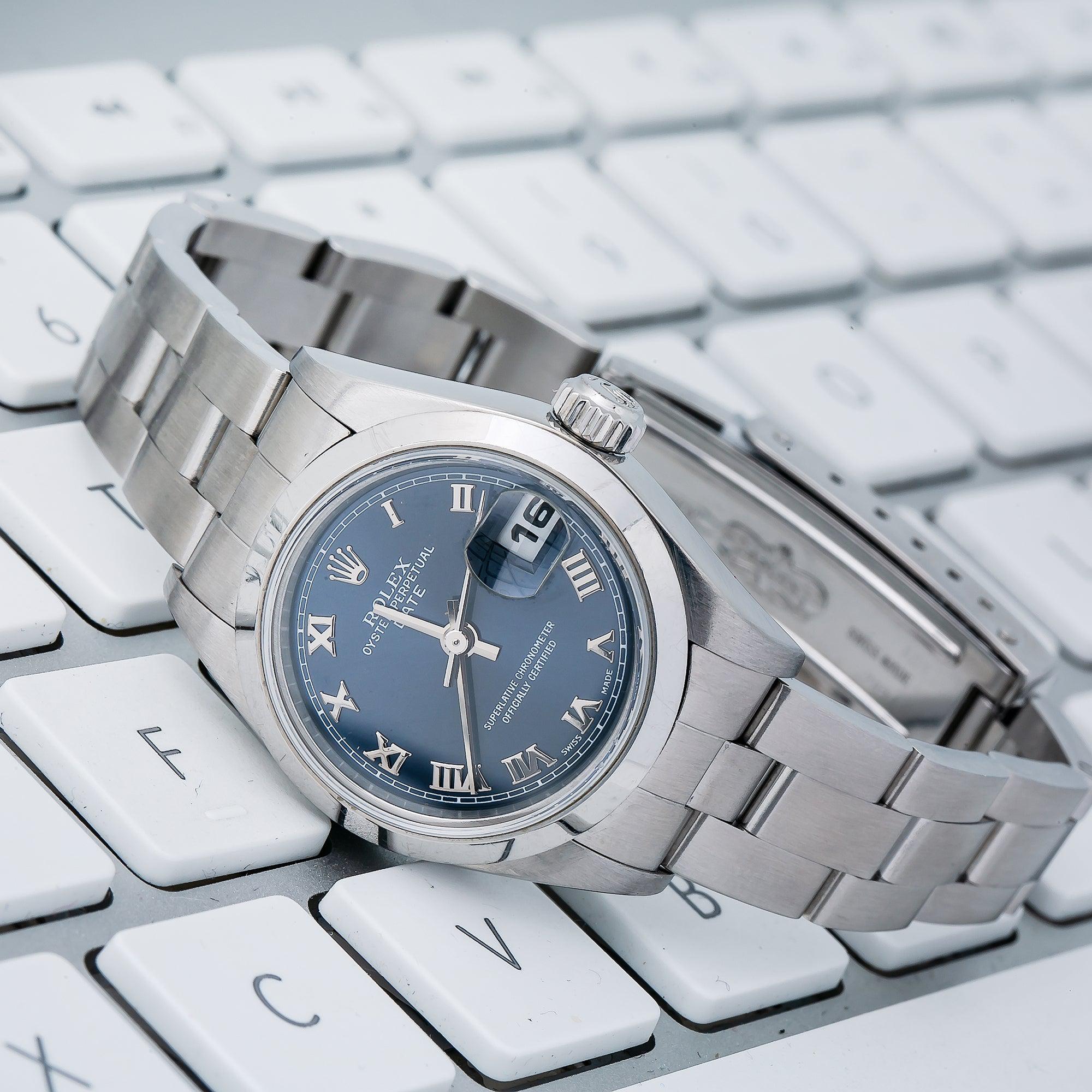 Rolex Date 26MM 79160 Blue Roman Dial Smooth Bezel Stainless Steel Oyster Bracelet